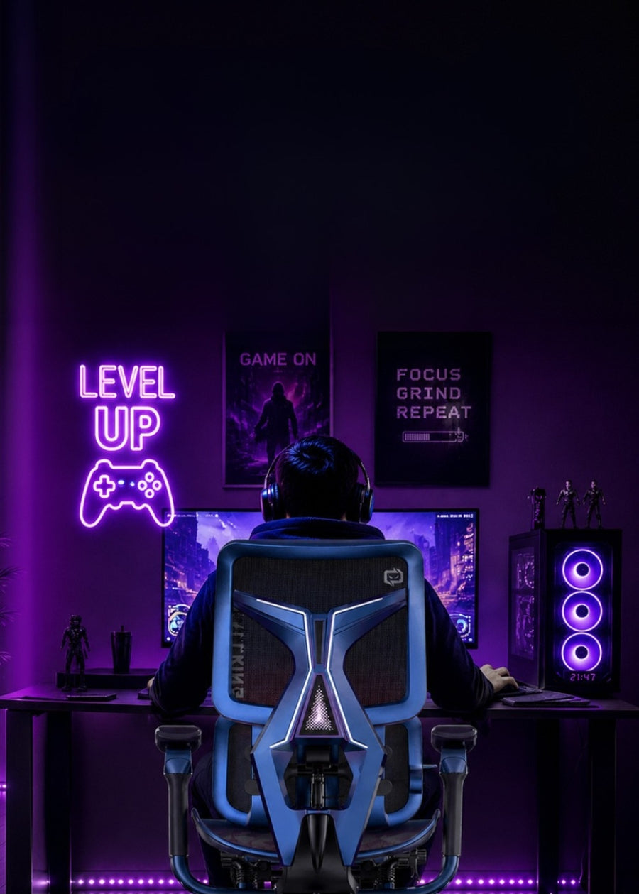 Person sitting in an ergonomic gaming chair in a dark room with purple lighting, facing a computer screen.