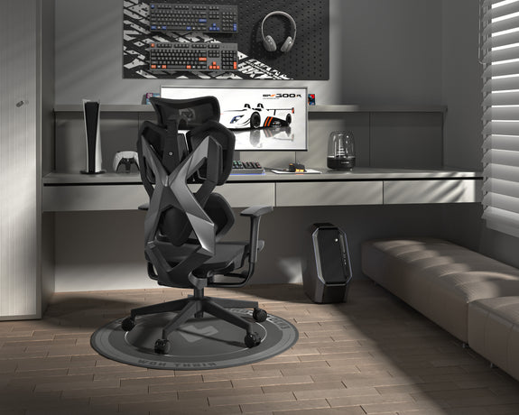 Gaming desk setup with ergonomic gaming chair in Australia, monitor, and gaming accessories in a modern room.